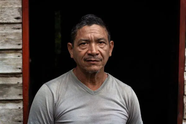 Portrait of an Amazonian community member connected to the Amazonbai cooperative, representing the people behind sustainable açaí harvesting, forest protection, and the fair trade values of Tupan Açaí Coffee.
