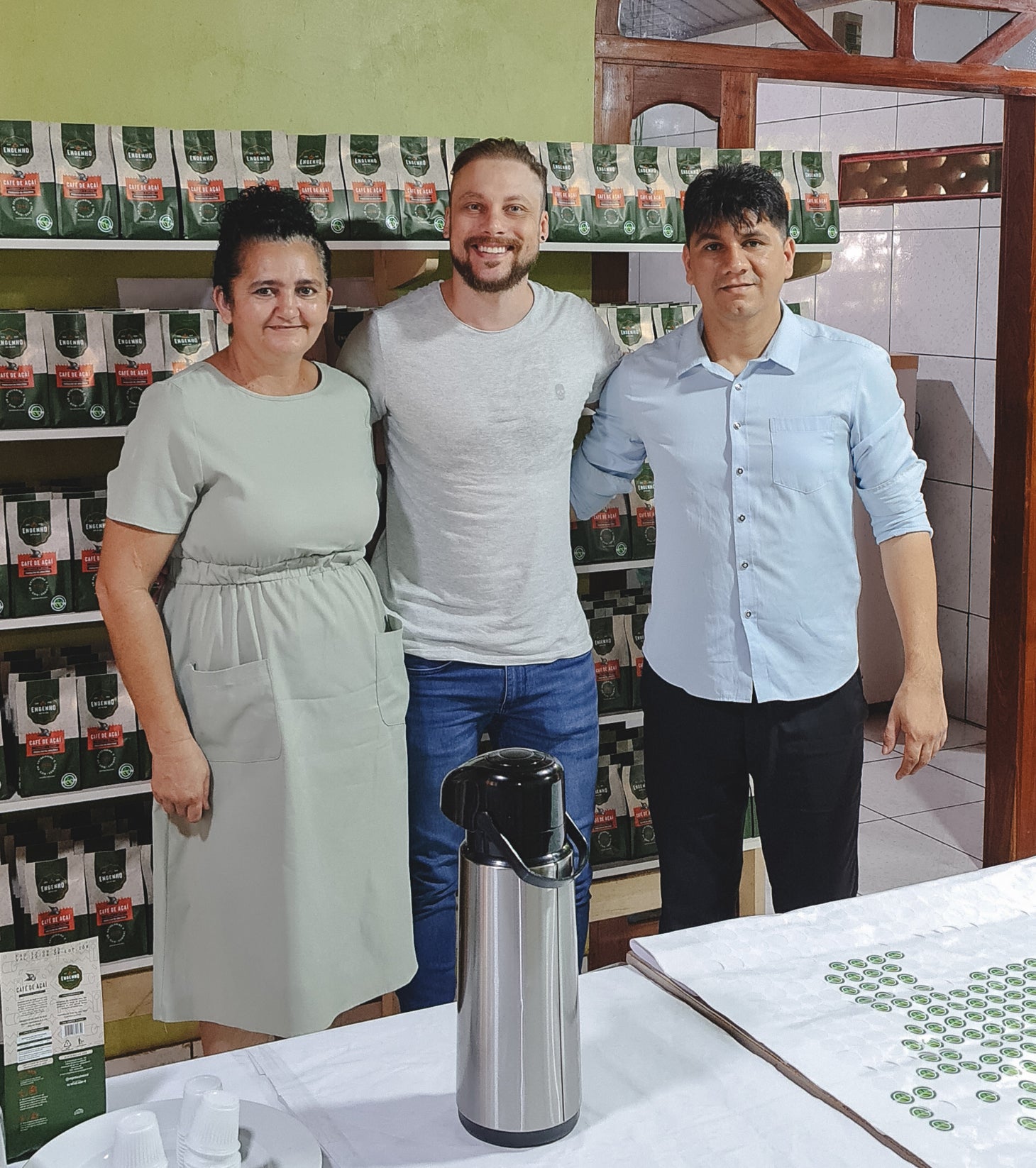 Mario from Tupan with Engenho Açaí Coffee founders at their factory in Brazil, celebrating sustainable açaí bean upcycling for specialty coffee production.